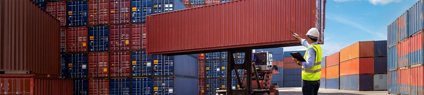 port supervisor directing train containers and a fork lift